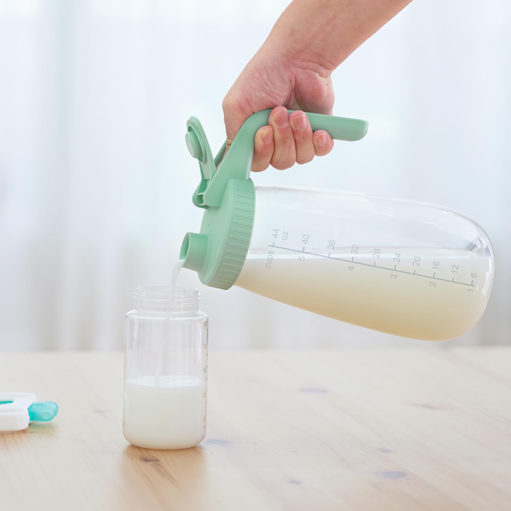Momcozy versatile pitcher doubles for formula, juice, coffee, or tea