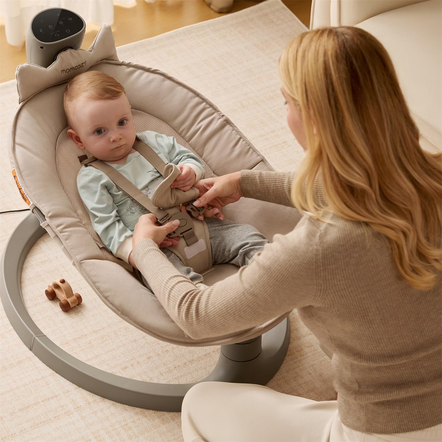Momcozy height-adjustable stand demonstrates flexible positioning for different spaces.