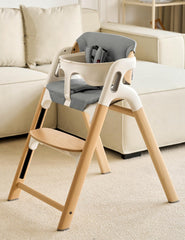 Momcozy high chair backrest ergonomic support enhances posture during meals.