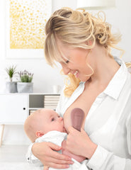 Momcozy massager in use during pumping for comfortable letdown