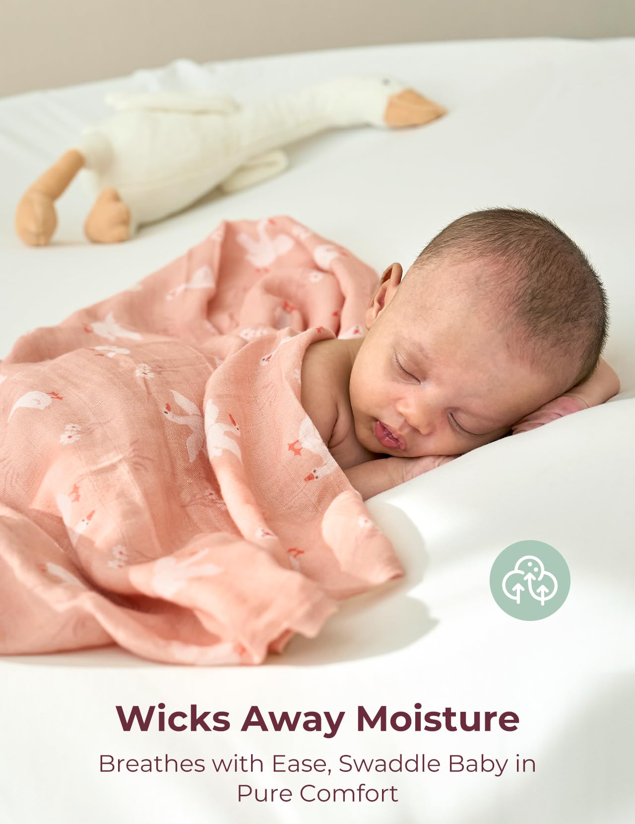 Wrapped baby demonstrates secure swaddle from Momcozy for smoother sleep transitions