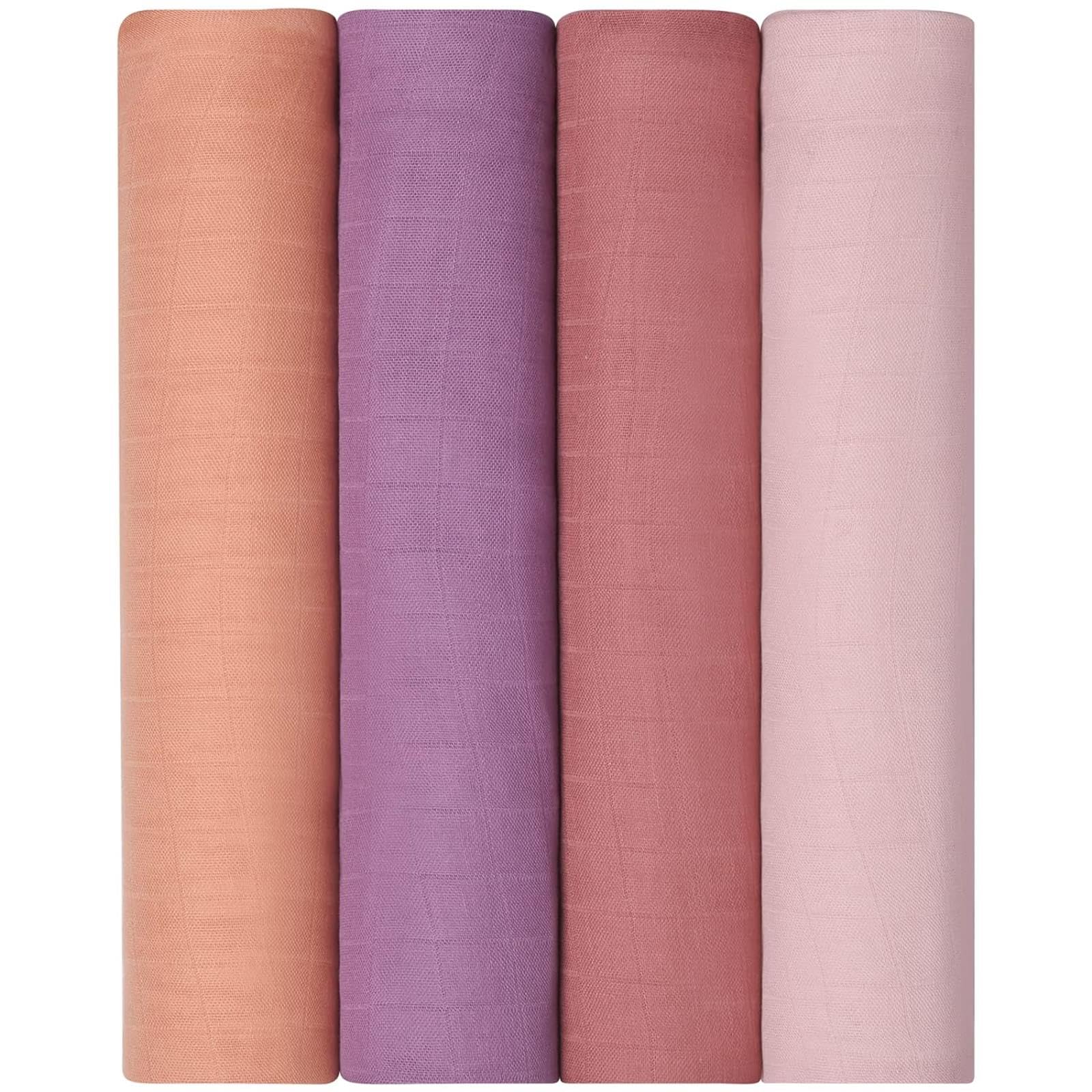 Earth-tone Momcozy blankets coordinated with baby outfits.