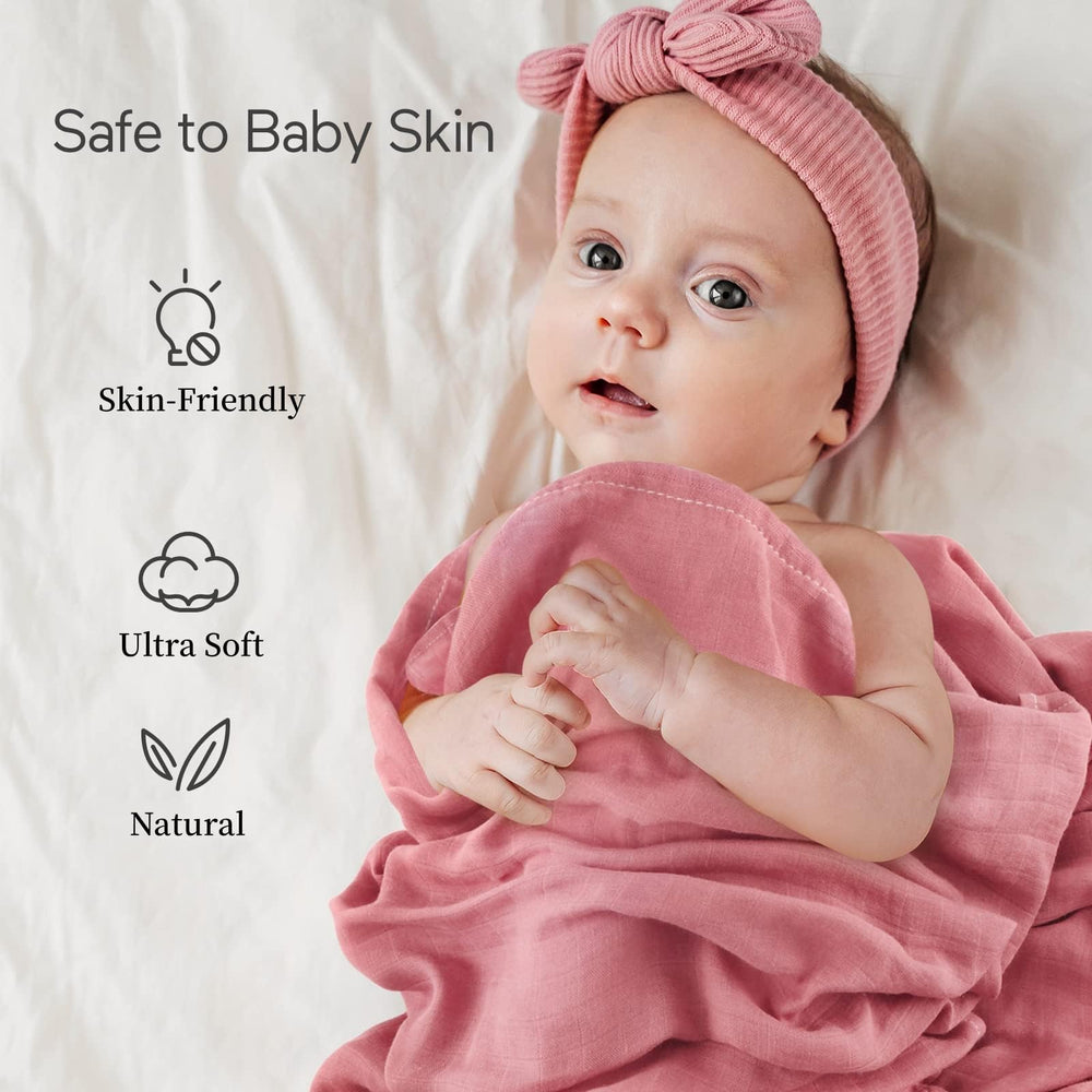 Momcozy Muslin Swaddle Blanket as diaper pad for on-the-go care.
