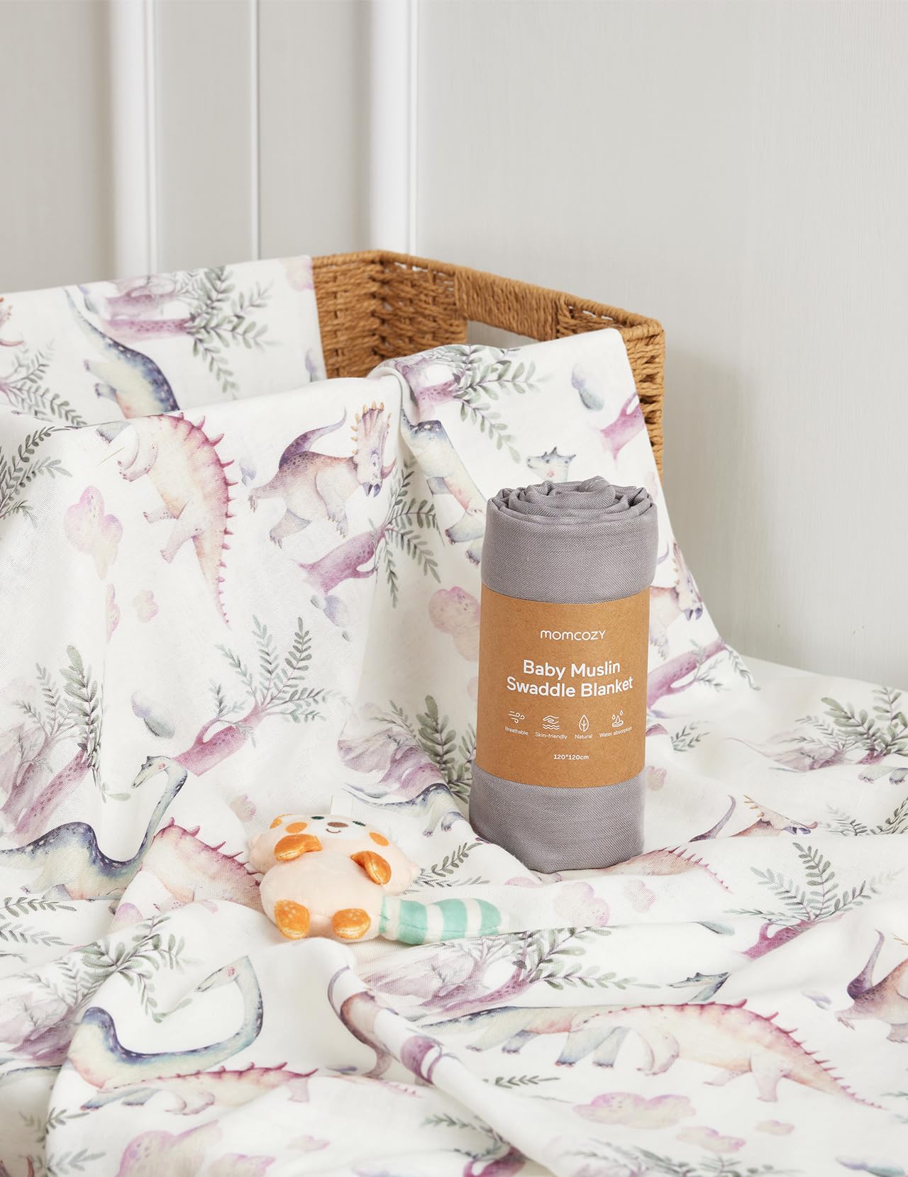 Momcozy muslin swaddle dinosaur-pattern adds playful baby photo moments.