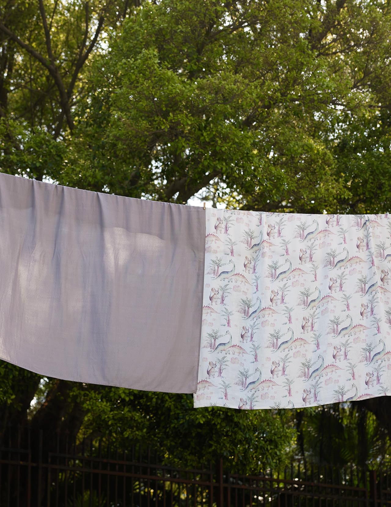 Momcozy muslin swaddle travel-nap ideal for on-the-go use.