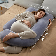 Momcozy full-body pillow in bed demonstrates sleep comfort and posture support.