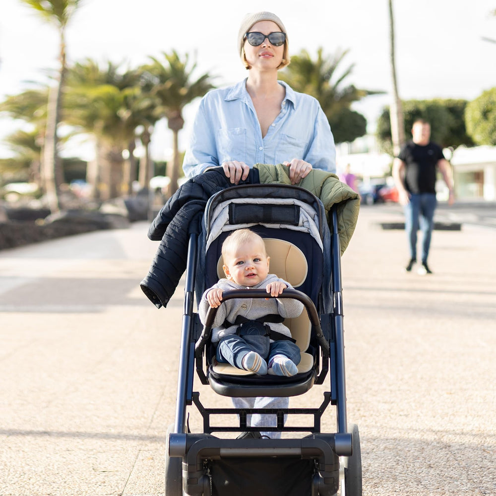 Momcozy breathable seat liner reduces sweat buildup for calm rides.