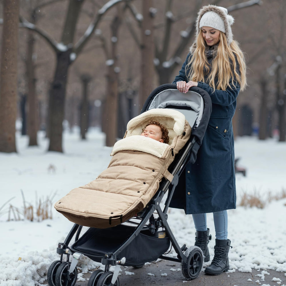Momcozy stroller footmuff weather-proof exterior blocks wind on winter walks.