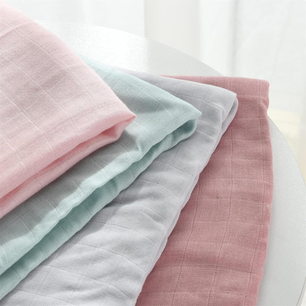 Momcozy blanket folded as burp cloth for quick spills and gentle cleanup