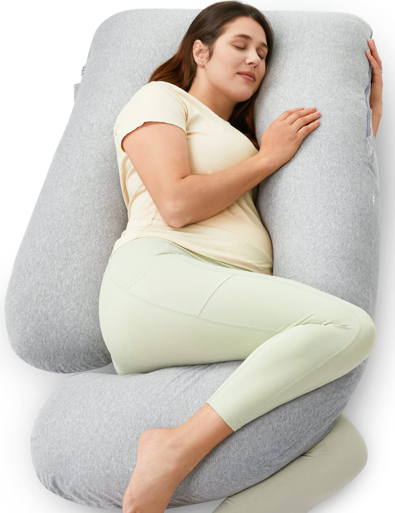 Momcozy U shaped pregnancy pillow on bed provides full body support for comfort.