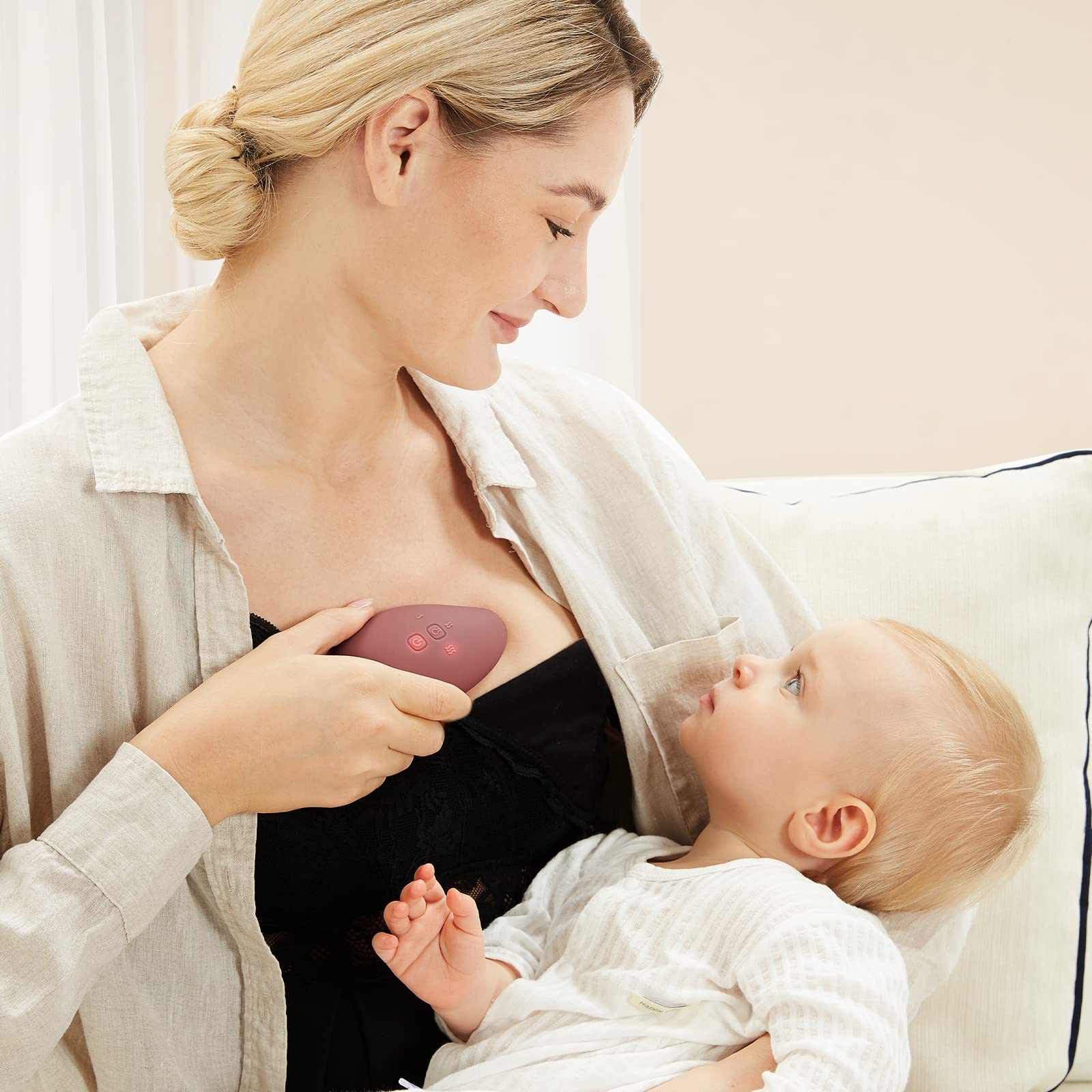 Momcozy massager aiding engorgement relief through warm massage.