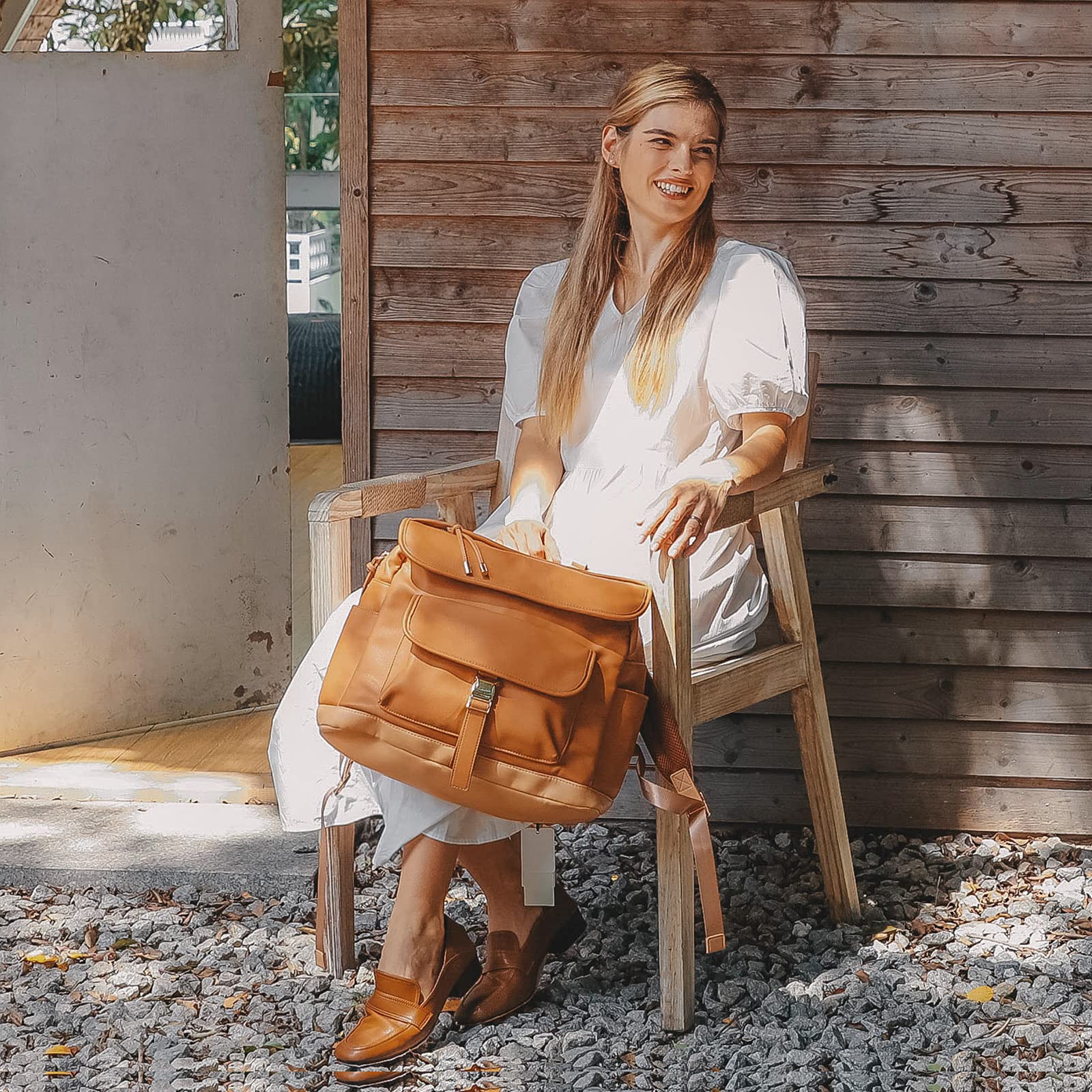 MOMINSIDE diaper bag backpack daily-use shows versatile, easy-clean materials.