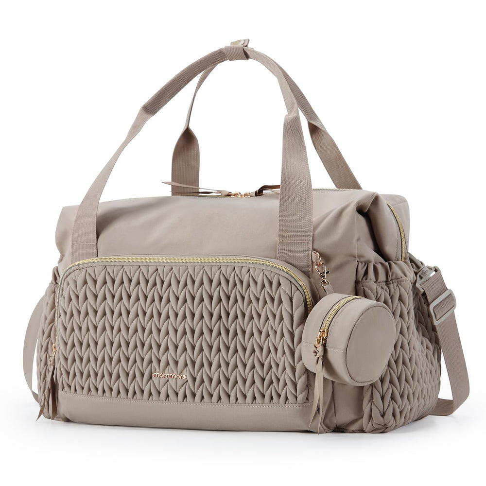 Mommore diaper bag tote shows spacious compartments for organizing baby essentials on the go.