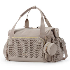 Mommore diaper bag tote shows spacious compartments for organizing baby essentials on the go.