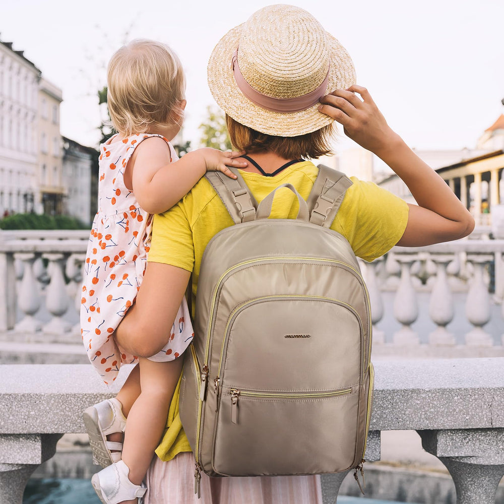 mommore water-resistant diaper bag stays stylish while repelling splashes outdoors.