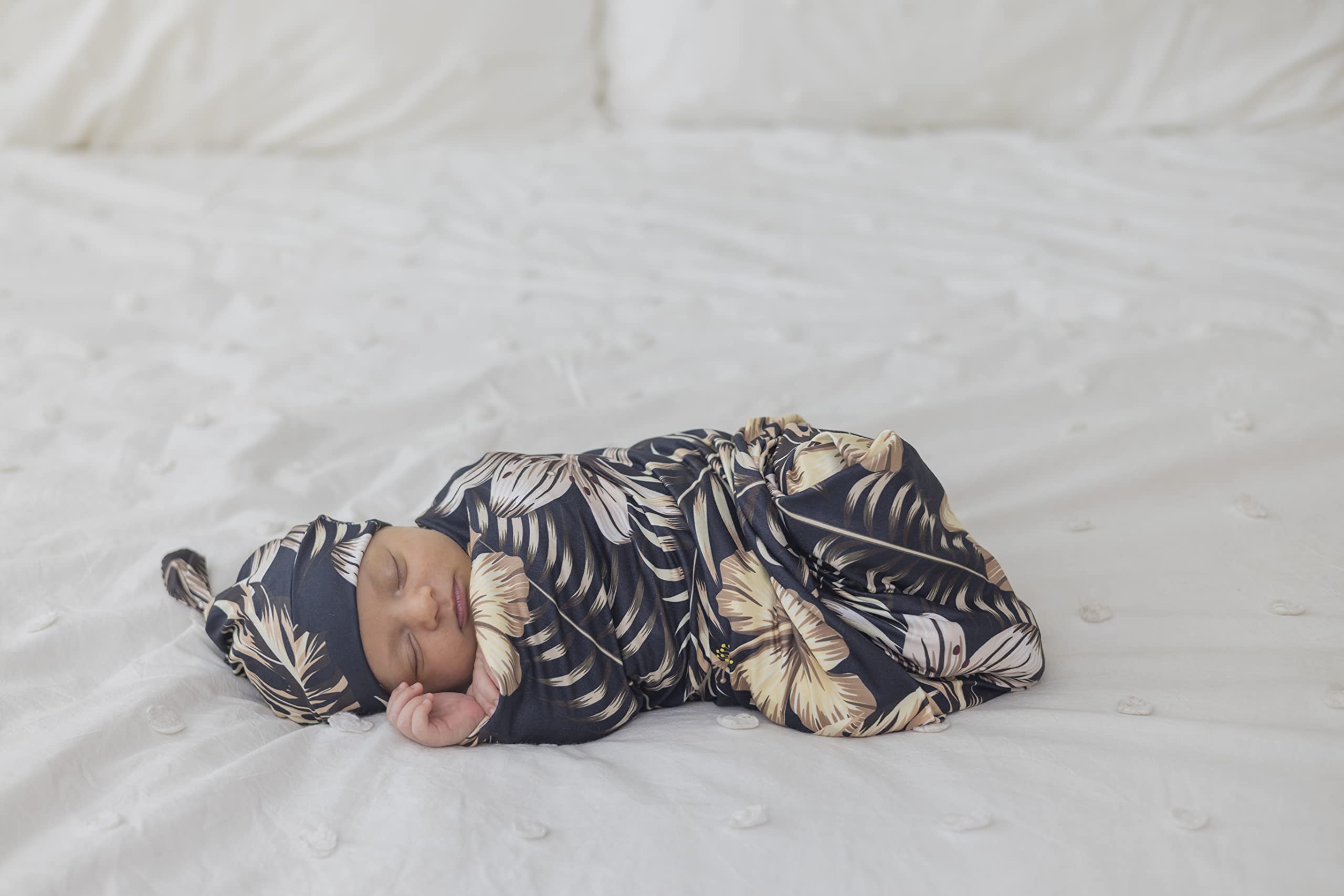 MOMMY O CLOCK baby swaddle wrap wrapped around baby in motion.