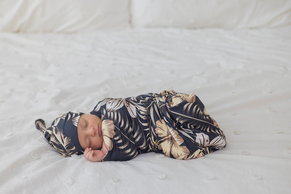 MOMMY O CLOCK baby swaddle wrap wrapped around baby in motion.