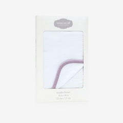 MOMS ON CALL swaddle blanket Peaceful Lilac shown with gift box for newborn gifting.