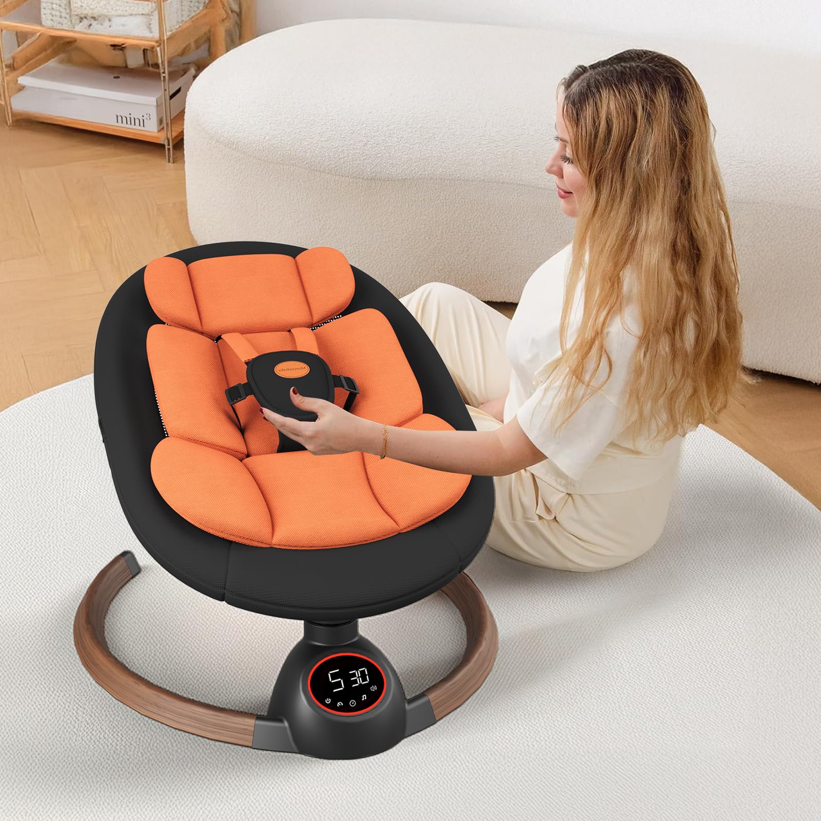 Monniebaby portable infant swing with compact travel-friendly design.