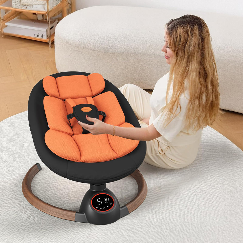 Monniebaby portable infant swing with compact travel-friendly design.