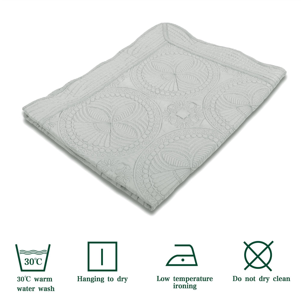 MONOBLANKS baby quilt nursery-decor-gray-trim complements modern crib linens.