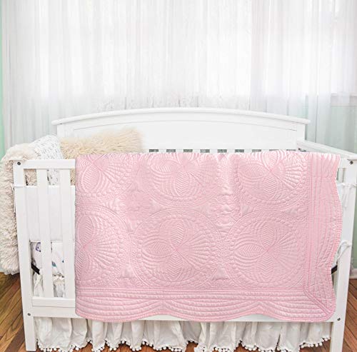 MONOBLANKS quilt doubles as nursery decor and cozy cover.