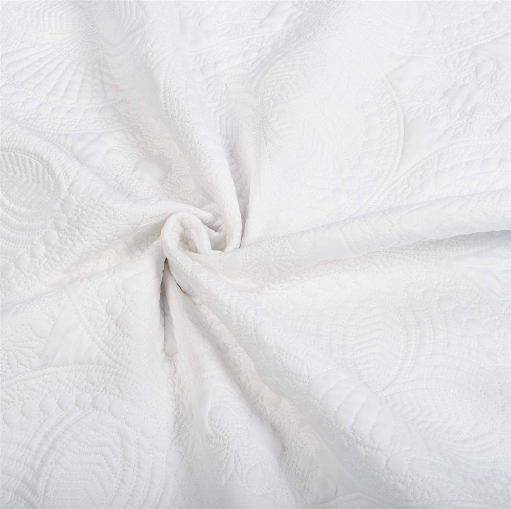 MONOBLANKS baby quilt packaged and folded for gift-ready presentation