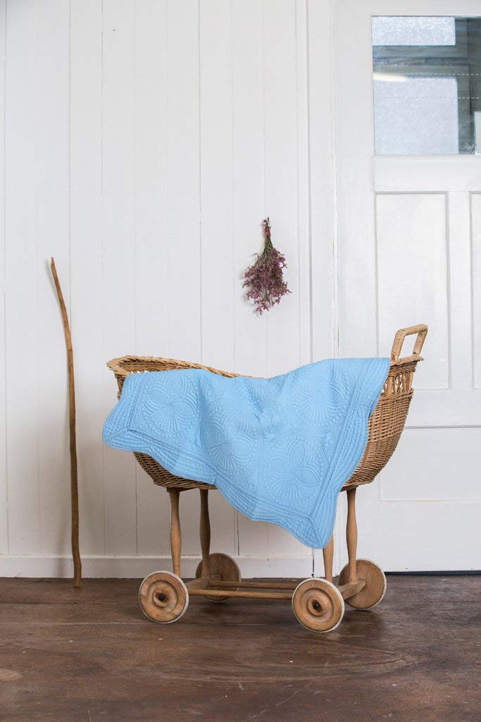 MONOBLANKS quilt serves as stroller cover and tummy-time helper in blue