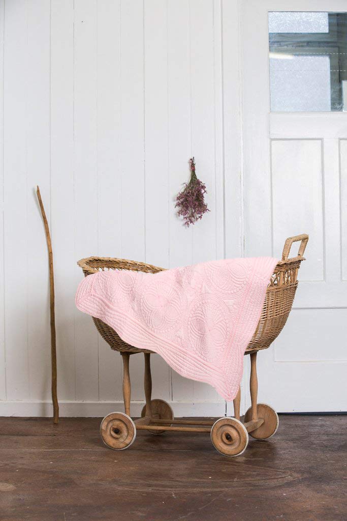 MONOBLANKS quilt lightweight for tummy time or stroller outings.