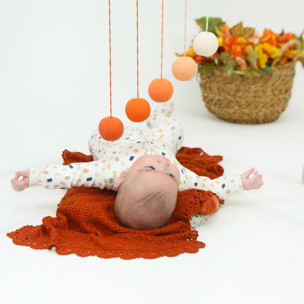 Montessori baby mobile Gobbi orange tone supports calm visual tracking