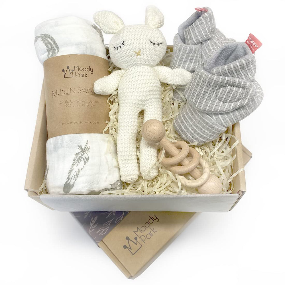 Moody Park baby gift basket swaddle blanket displays soft organic cotton for cozy newborn comforting wrap.