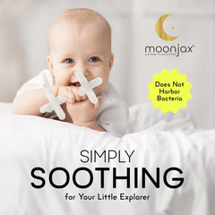 Moonjax teether held in hand demonstrates safe, soft silicone for gums.