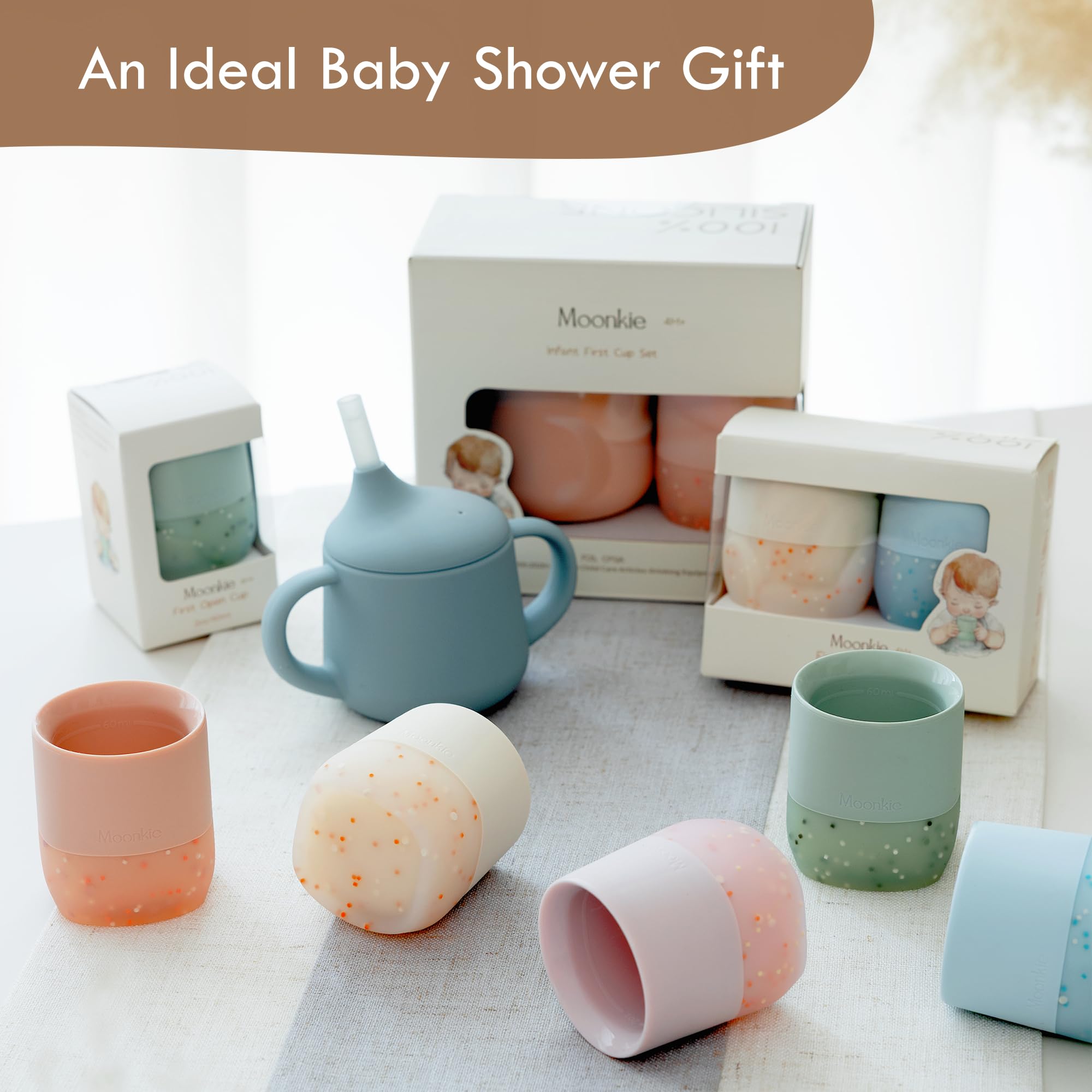 Moonkie ergonomic grip supports tiny hands during self-feeding.