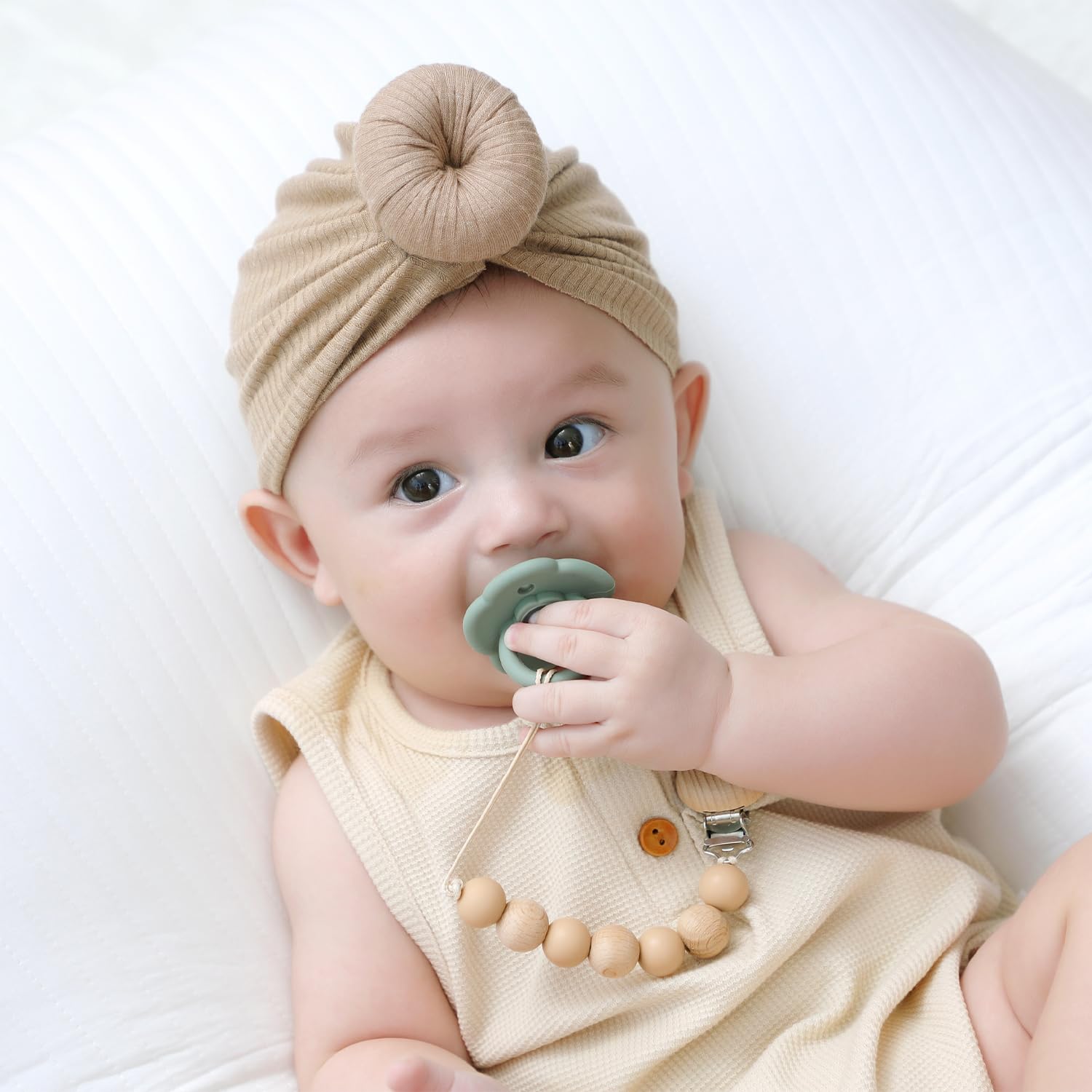 Moonkie pacifiers made of BPA-free silicone for safe chewing and soft contact.