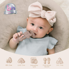 Moonkie Koala Warm Taupe baby holding teether for easy grip during soothing sessions