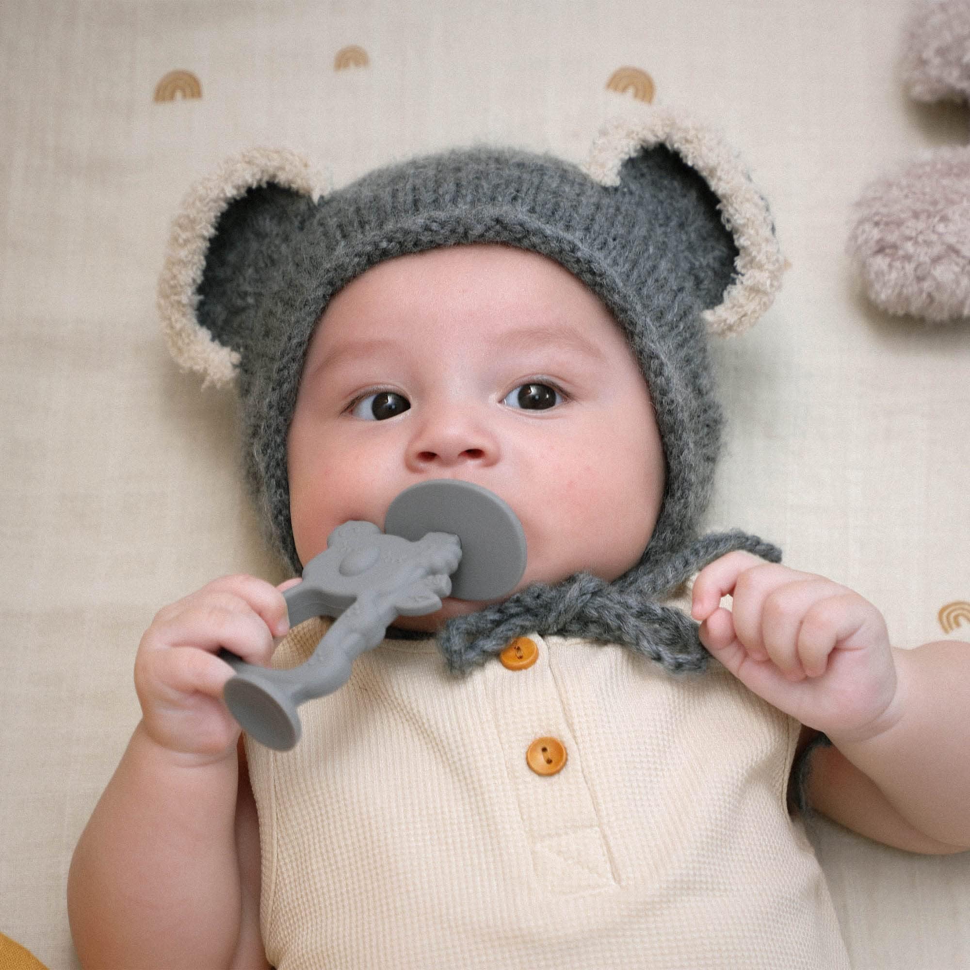 Moonkie Koala Warm Taupe teether used for brushing practice and transition aid
