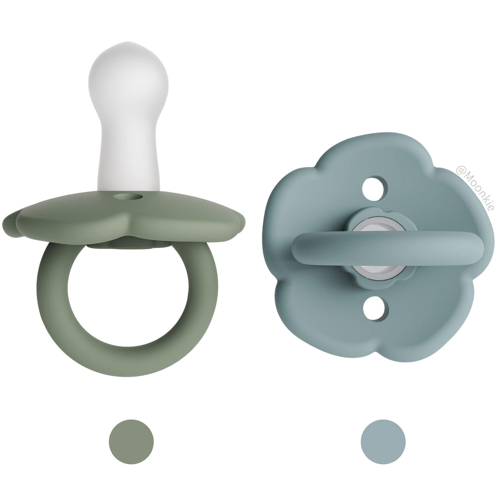 Moonkie pacifiers Daisy two-pack set highlights stylish design for baby soothing on the go.