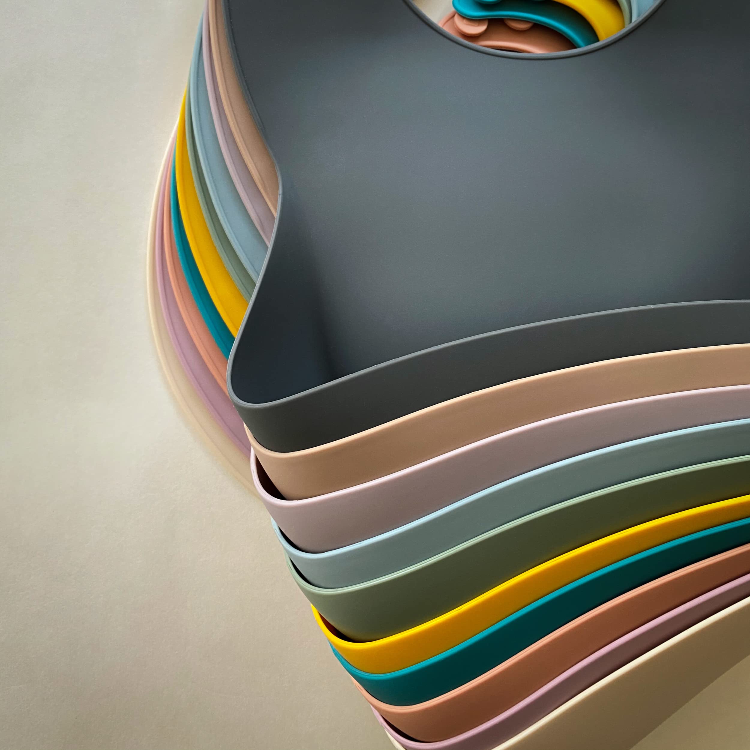 Moonkie travel-friendly bib — folds compactly for diaper bags on the go.