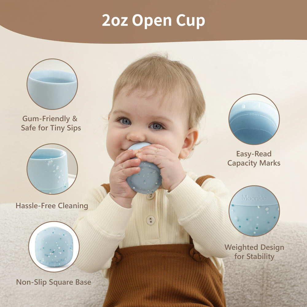 Moonkie ergonomic-handles cup helps small hands grip securely during practice sips.