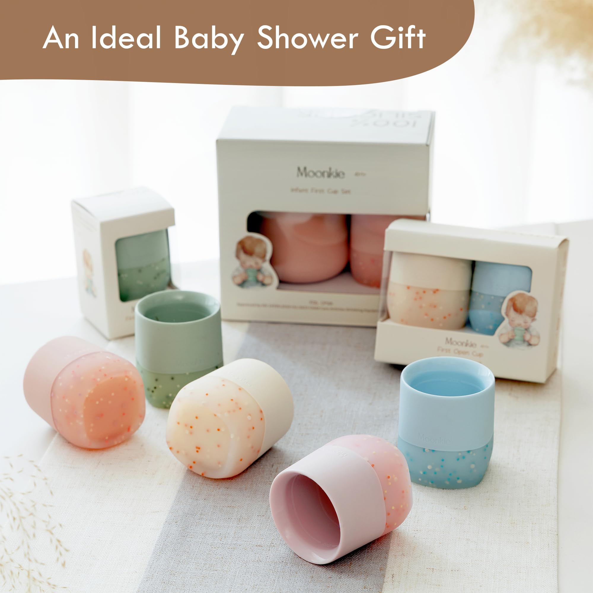 Moonkie blush-colored silicone cup makes a charming, gift-worthy addition to nursery mealtimes.
