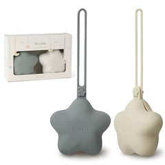 Moonkie silicone pacifier holder case two-pack offers portable storage for pacifiers on the go.