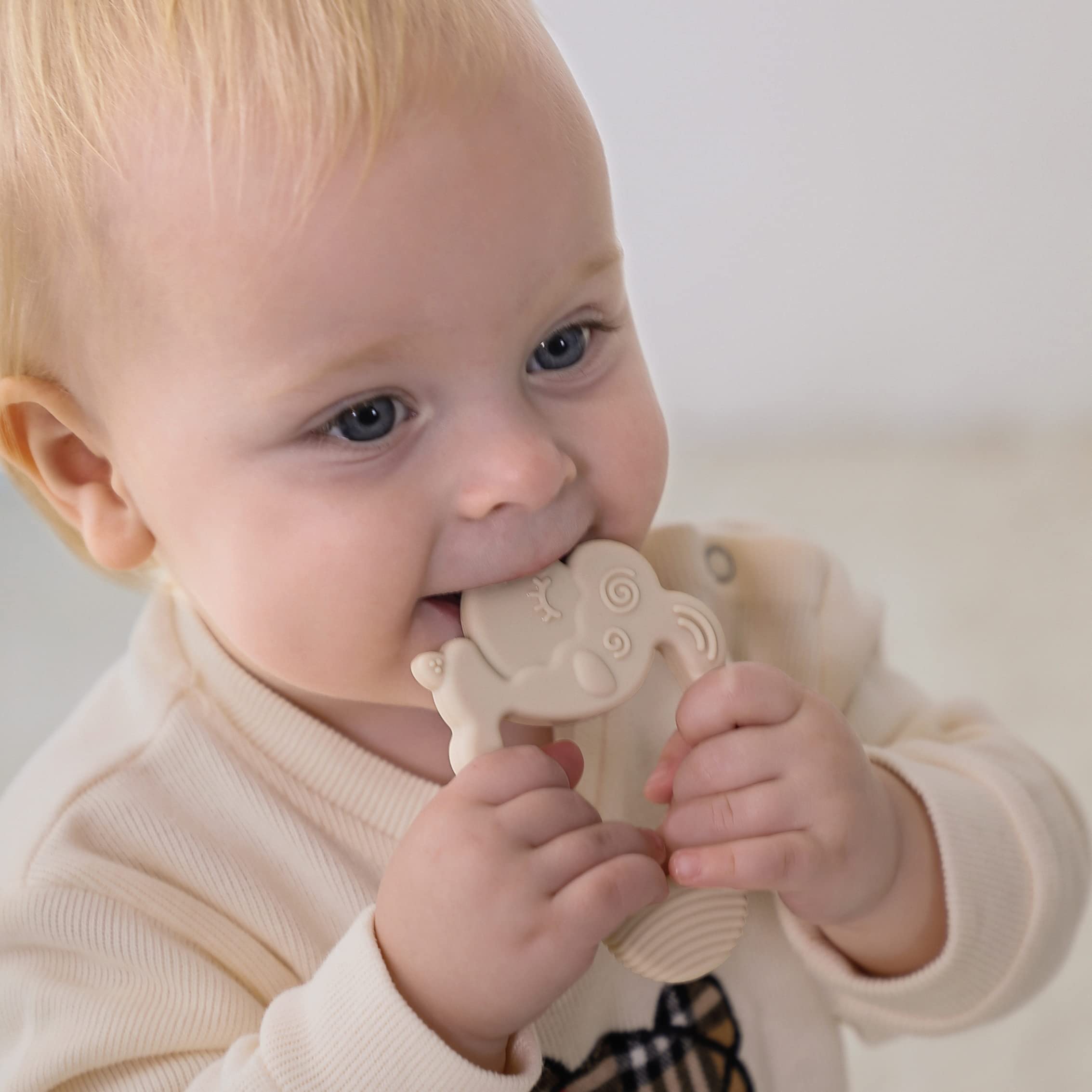 Moonkie teether made from BPA-free silicone for safe chewing during playtime.
