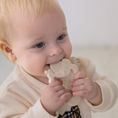 Moonkie teether made from BPA-free silicone for safe chewing during playtime.