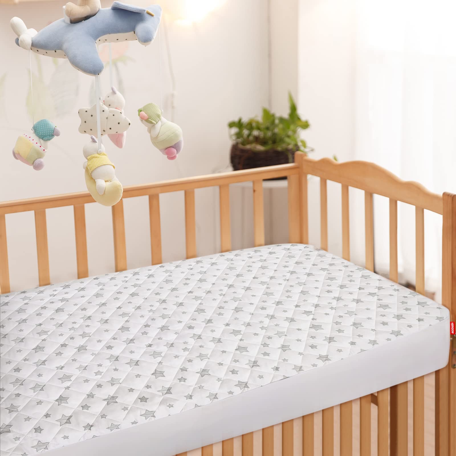 Moonsea 52x28 inch stretch fit cover fits snugly on standard cribs.