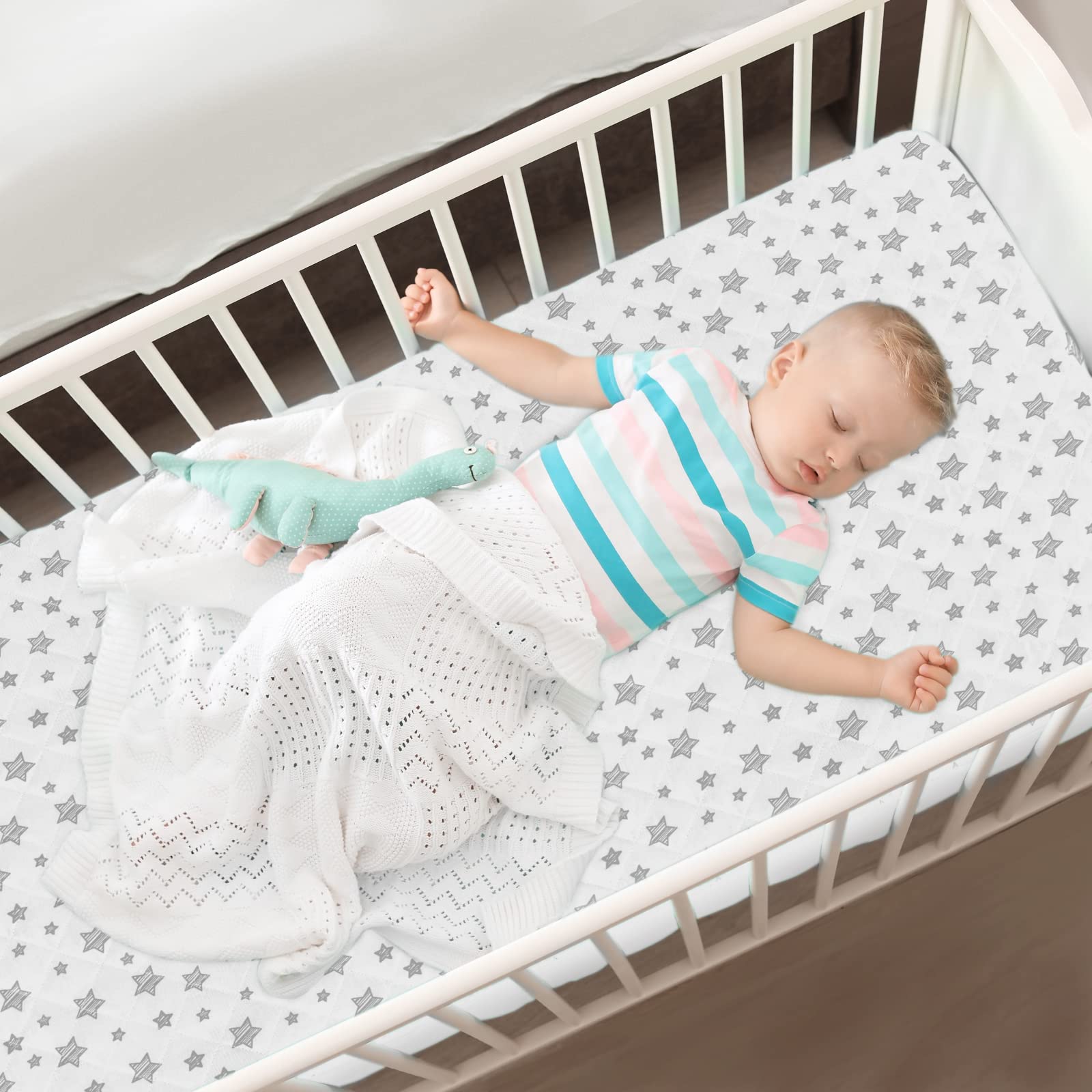 Moonsea white star pattern adds gentle nursery style to any crib.
