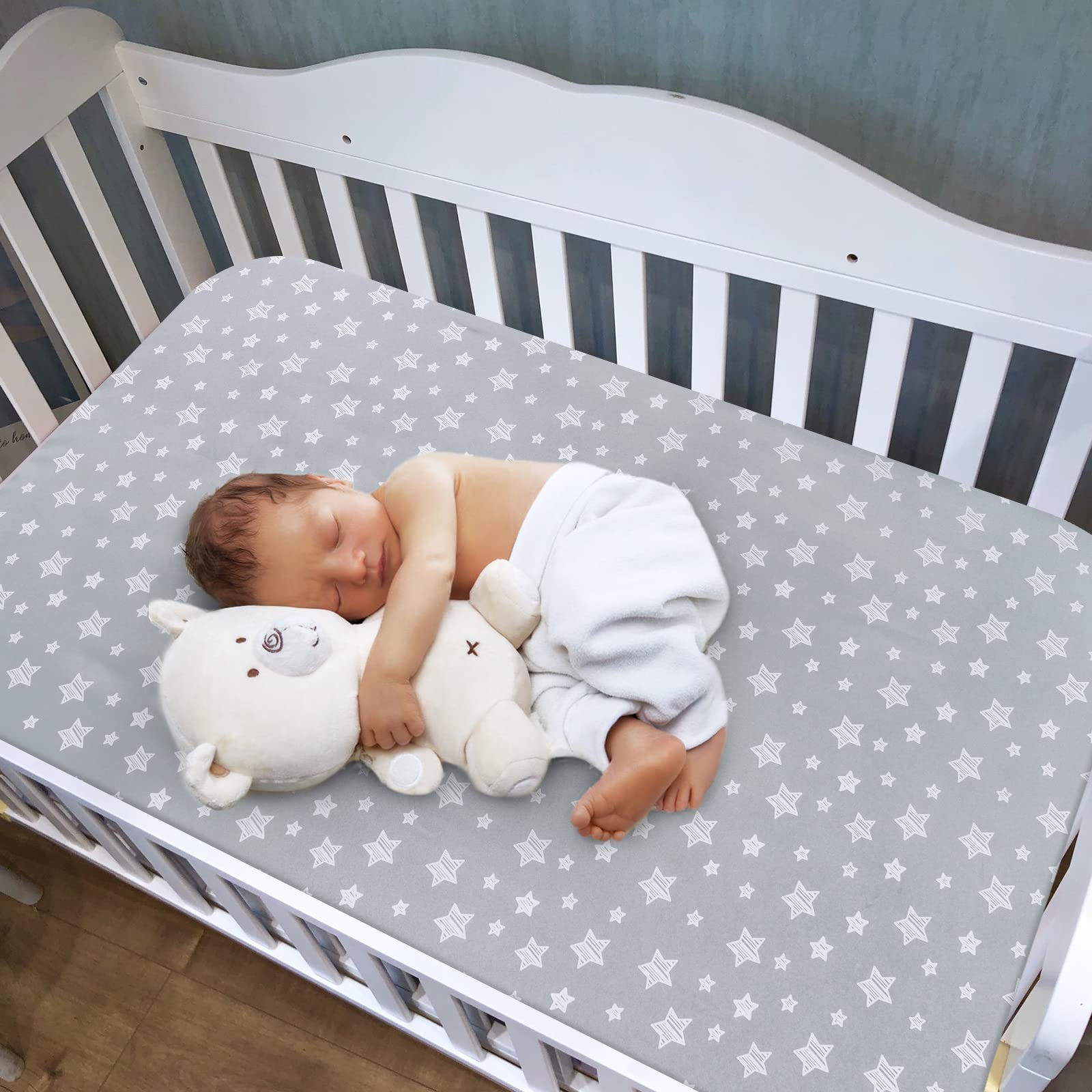 Moonsea crib sheets snug-fit elastic edge demonstrates secure fit on standard crib mattress.