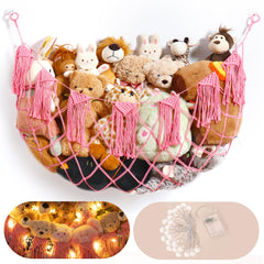 Morcco macrame hammock mounted on pink wall for stylish plush toy storage