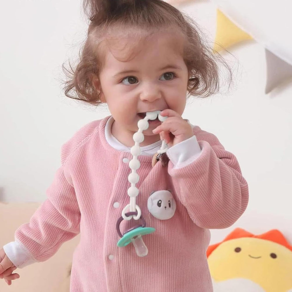 MORIBOX pacifier clip closeup shows durable clip and safe materials for caregiver confidence.