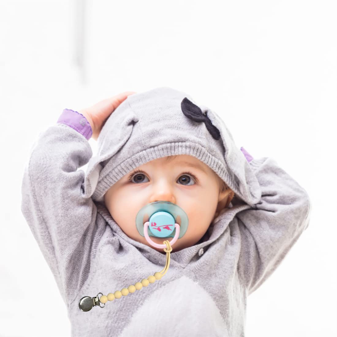 MORIBOX pacifier clip white coordinates with outfits and keeps pacifier clean and accessible.