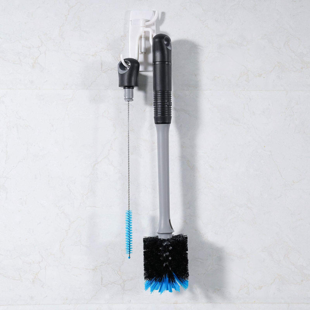 MOSOLAN straw brush nests inside the handle for tidy storage and quick access.